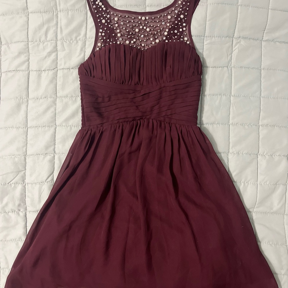 Elegant Burgundy Dress with Embellished Neckline